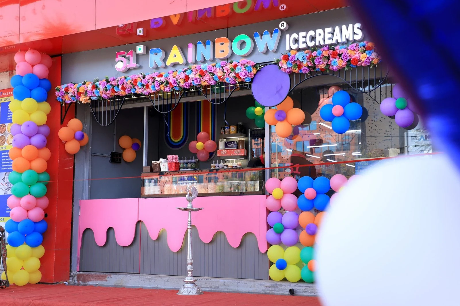 https://51rainbowicecream.com/wp-content/uploads/2026/04/51-rainbow-ice-cream-shop-front-colorful-decor.webp